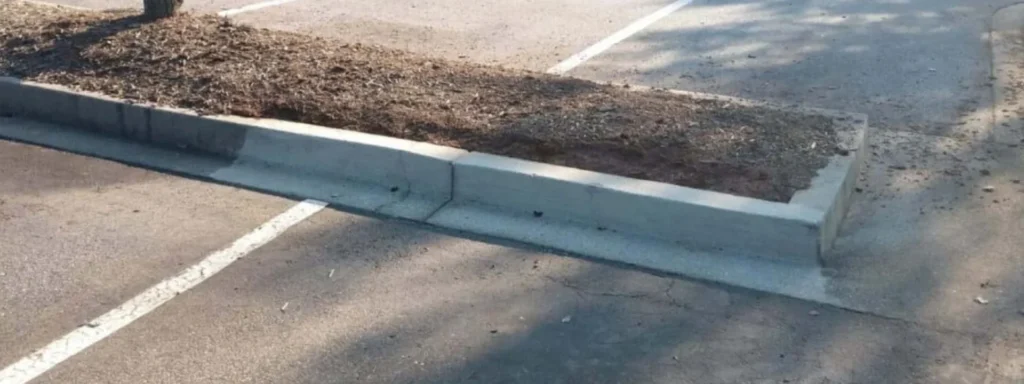 Concrete wheel stop in empty parking stall