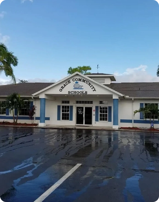 Grace Community Schools building, wet parking lot