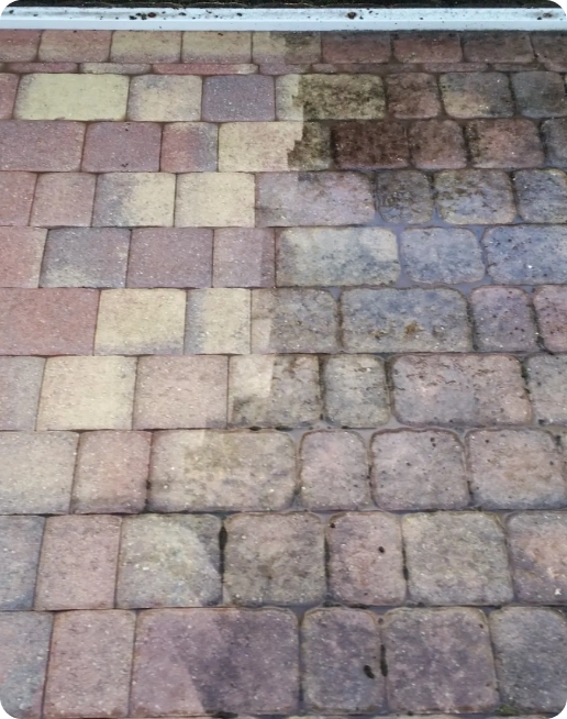 Pressure-washed patio pavers before and after