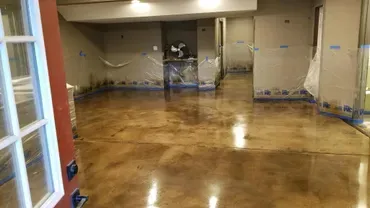 Glossy stained concrete basement floor under renovation