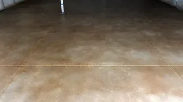 Polished stained concrete garage floor with joints