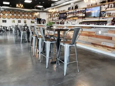 Industrial bar interior with metal stools