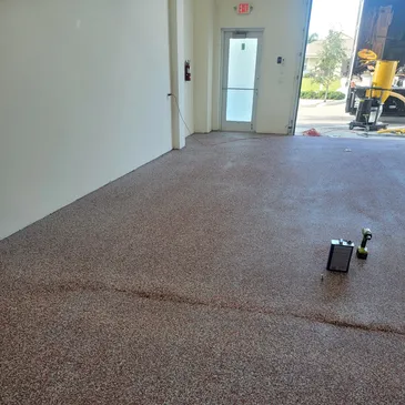 Empty workshop with speckled epoxy floor