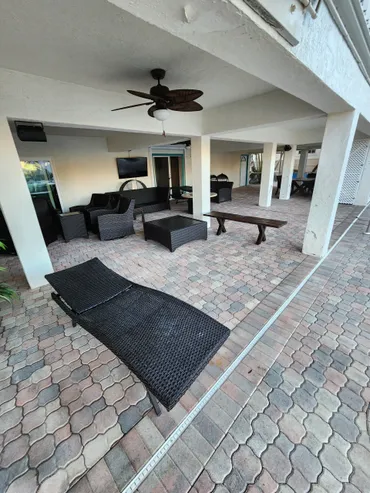 Covered patio with wicker lounge chairs