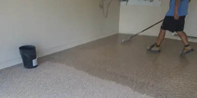 Person mopping floor with bucket
