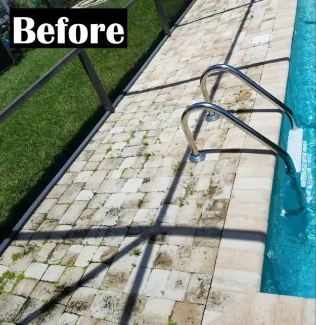 Stained pool deck pavers before cleaning