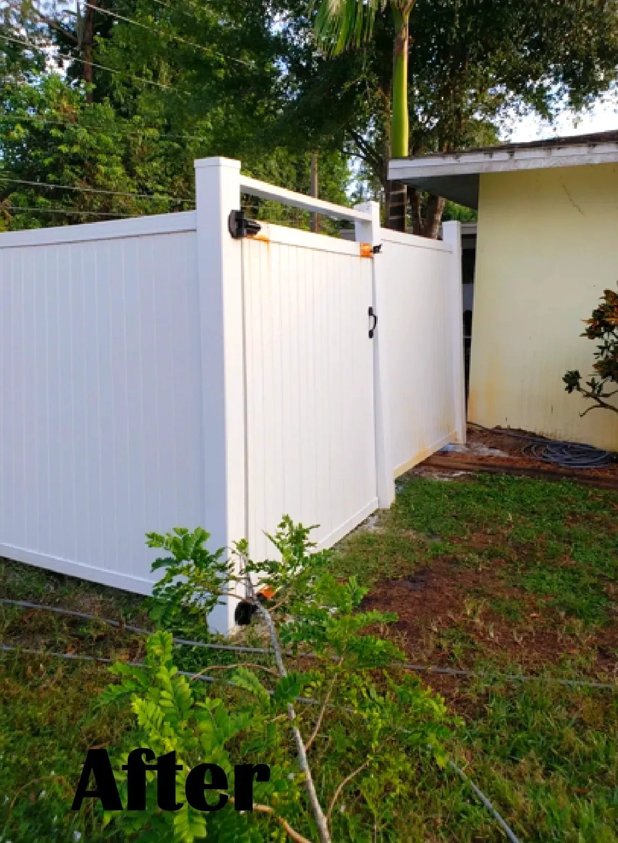 White vinyl privacy fence with gate