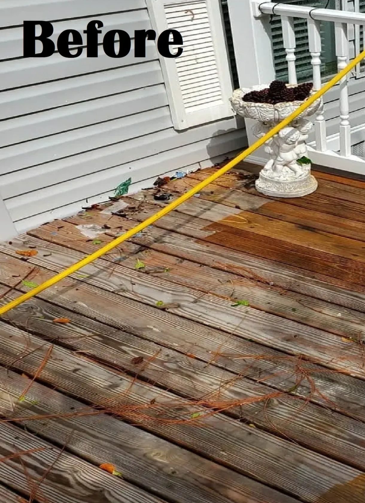 Weathered wooden deck covered in leaves