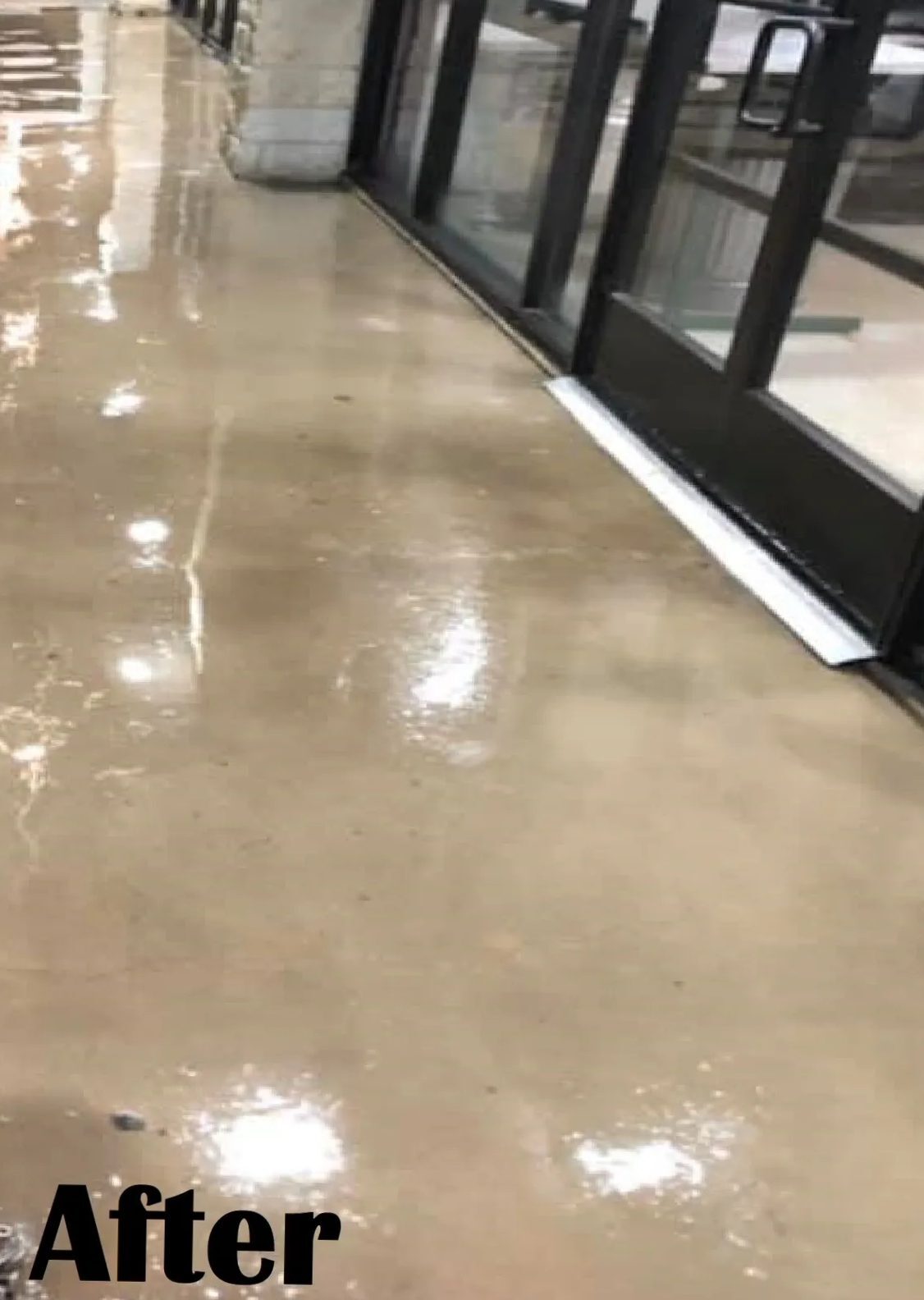Polished wet concrete floor near glass doors