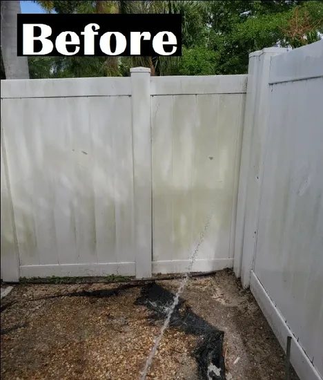 Dirty white vinyl fence before cleaning