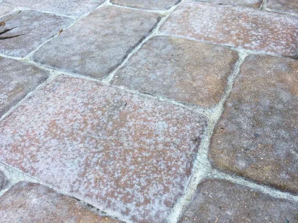 Close-up of weathered square stone pavers