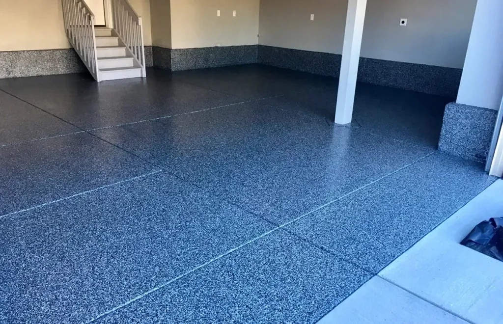 Speckled epoxy garage floor with staircase