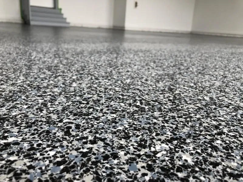 Speckled epoxy garage floor texture close-up