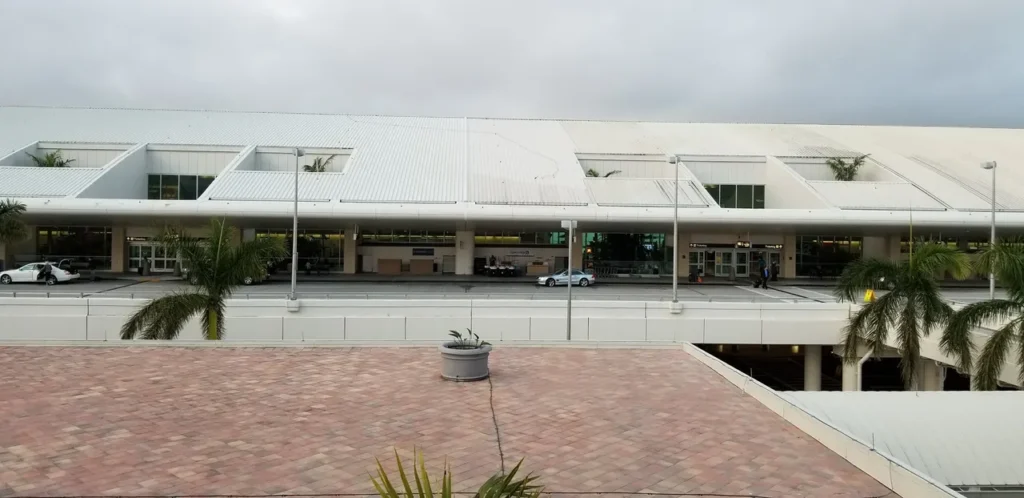 Airport terminal exterior with palm trees