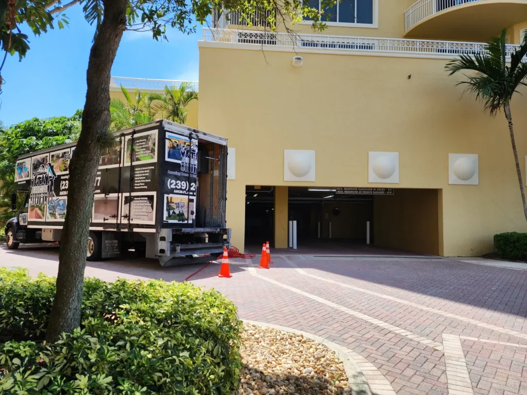 Moving truck at apartment garage entrance