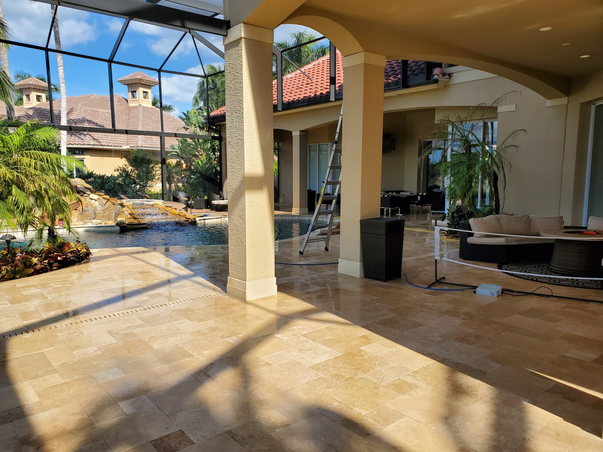 Screened patio with pool and seating area