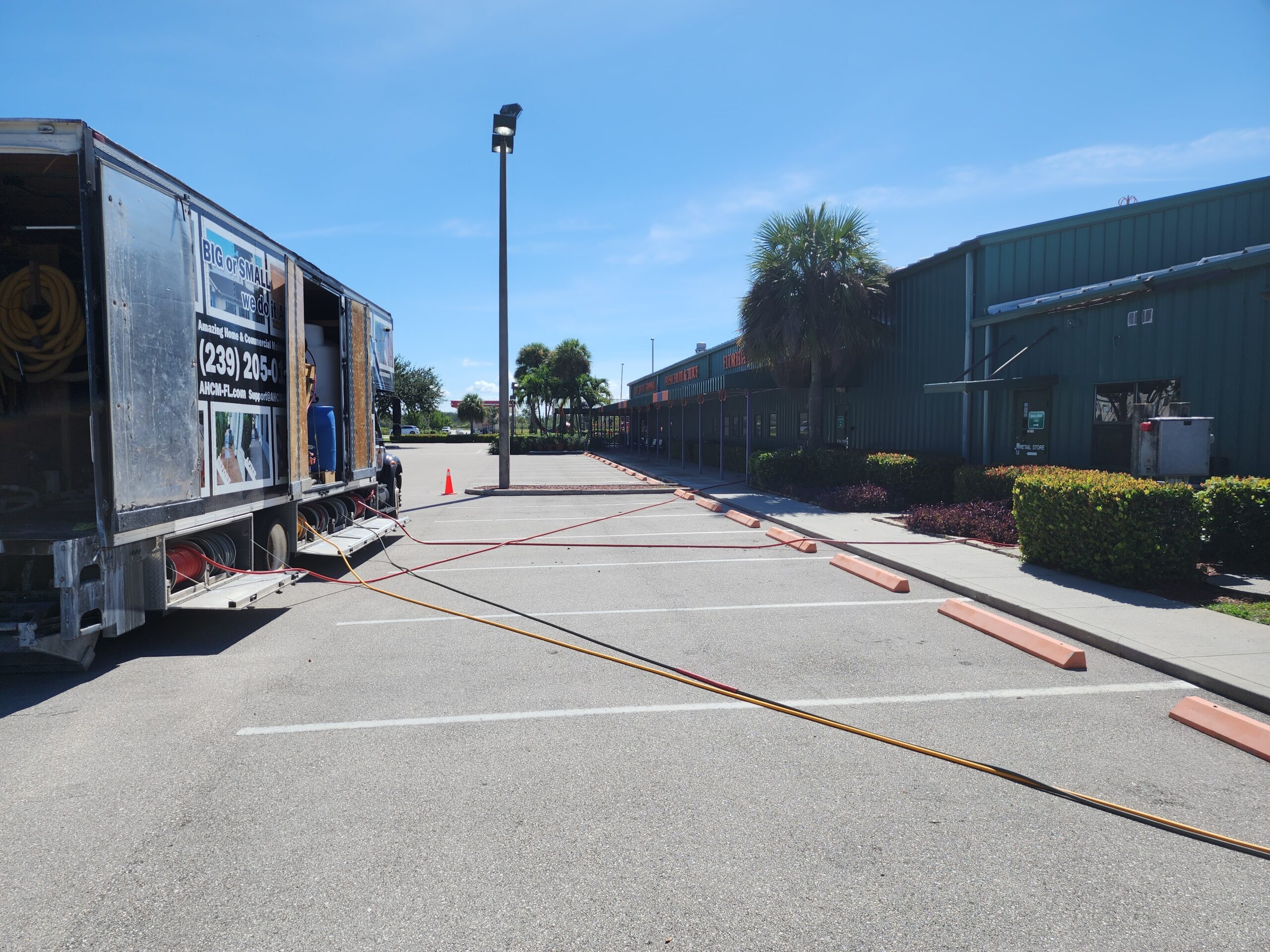 Utility truck with cables in empty parking lot
