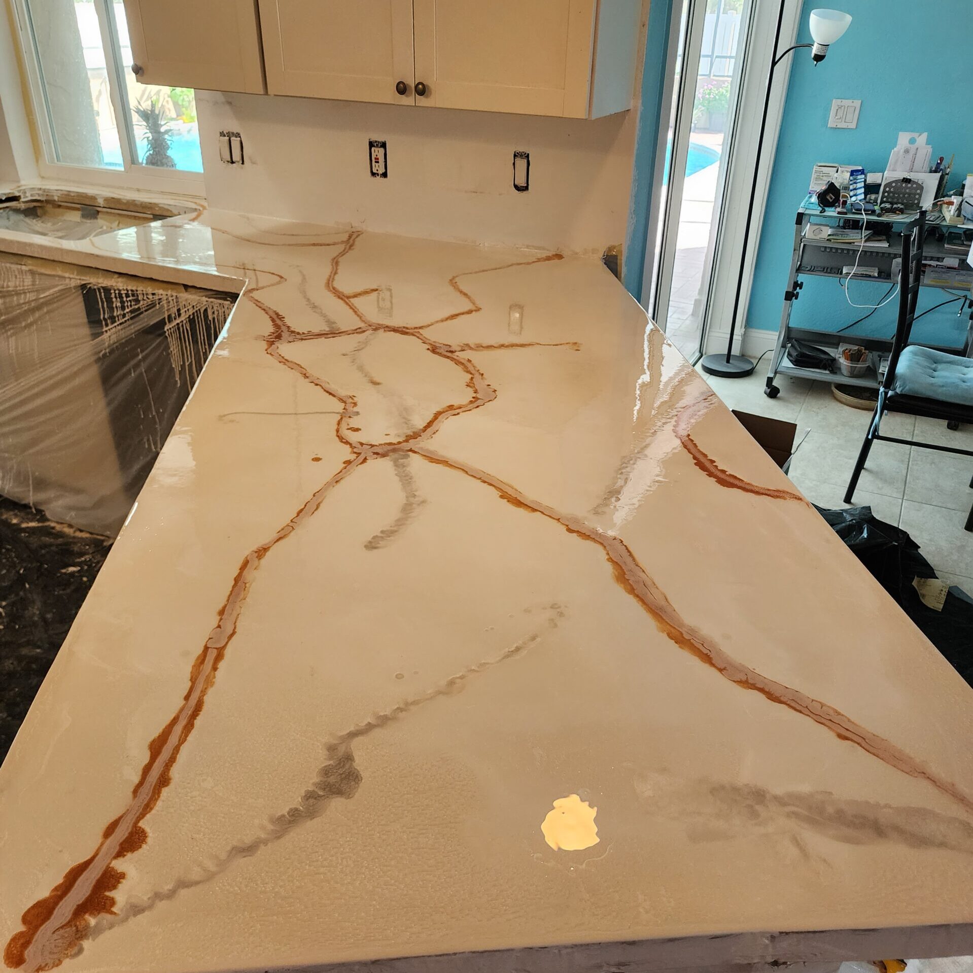 Polished marble kitchen countertop with brown veining