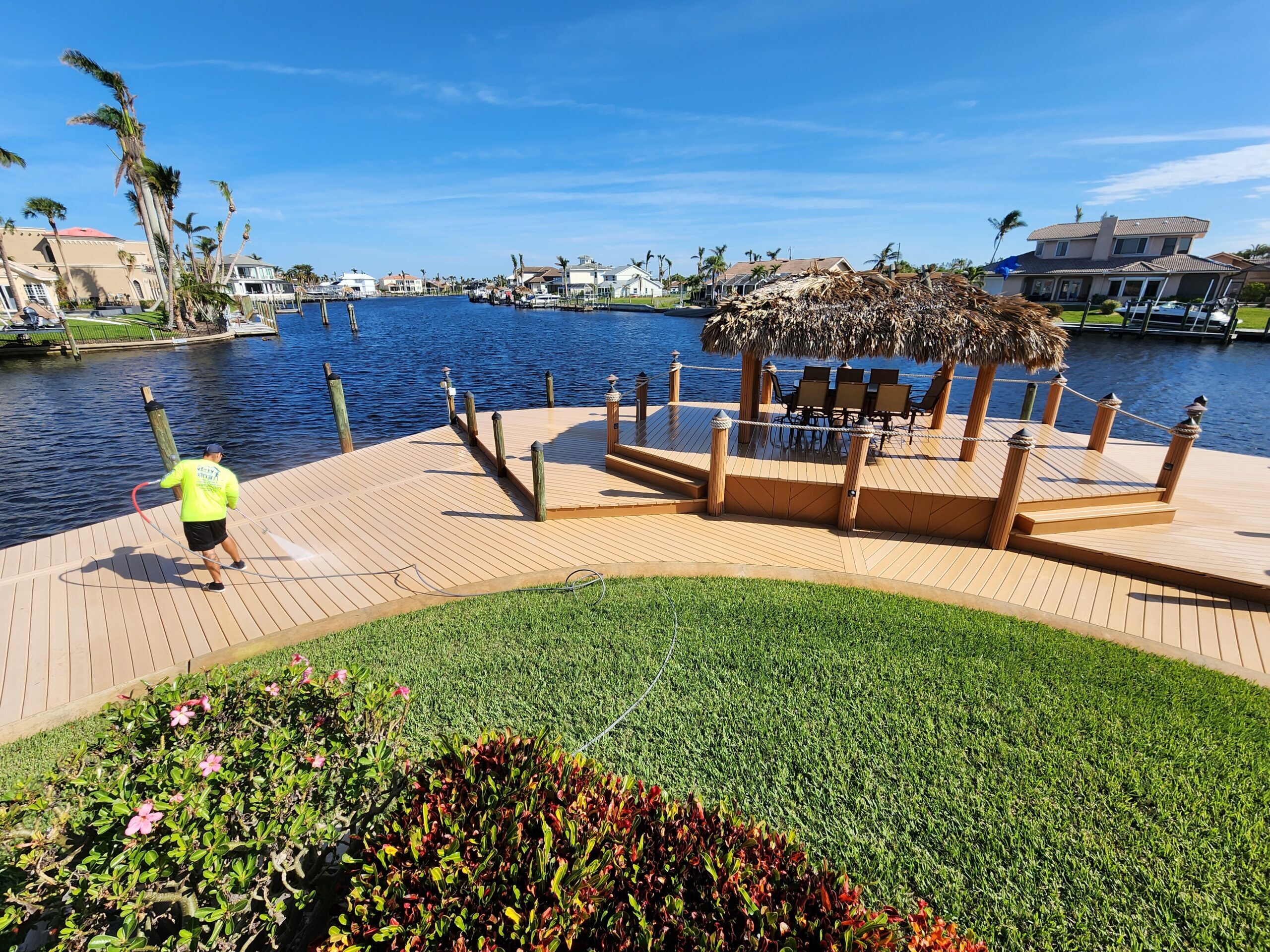 Waterfront dock with tiki hut and person