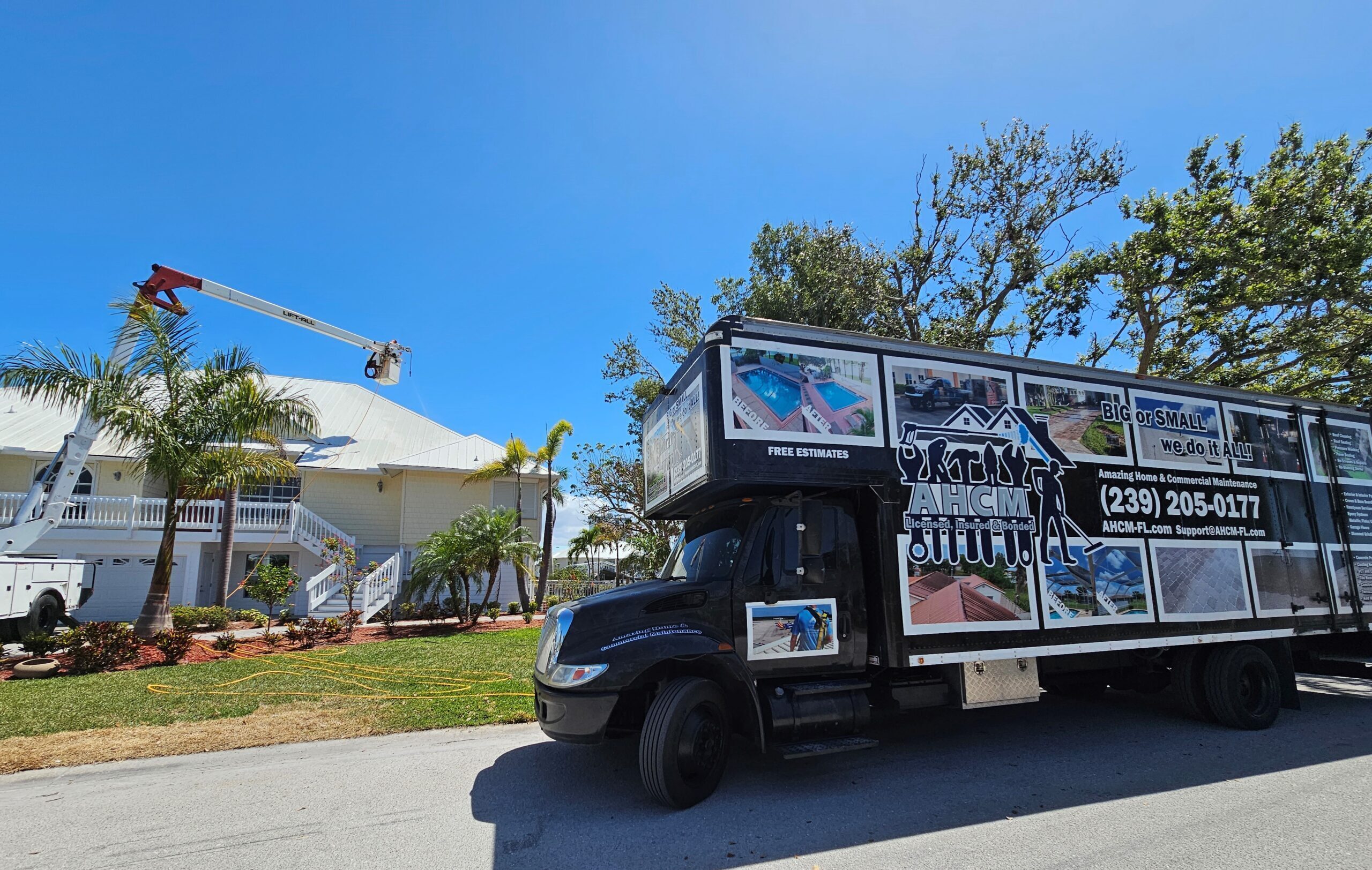 Service truck with bucket lift at house