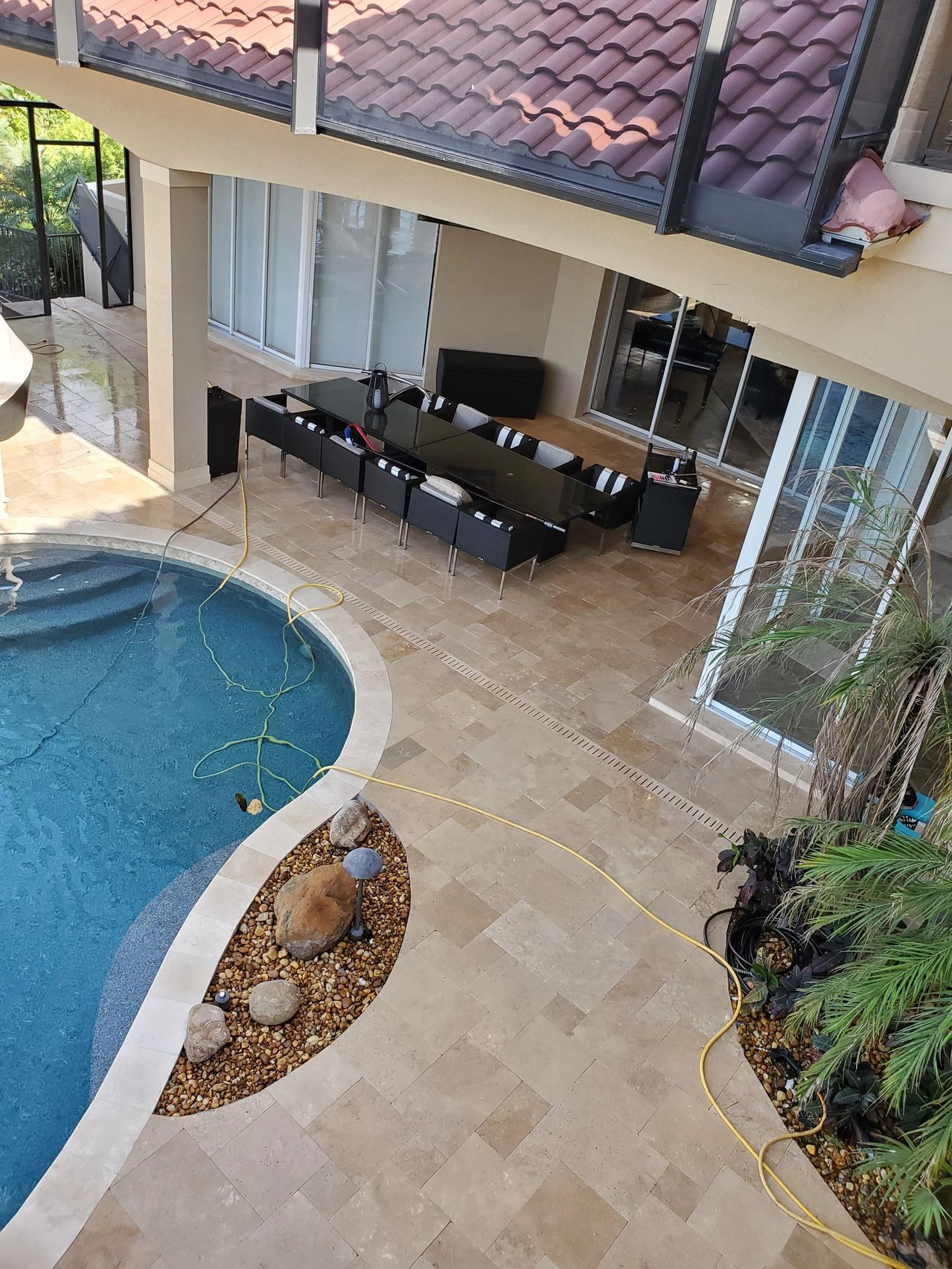 Backyard pool with patio dining area