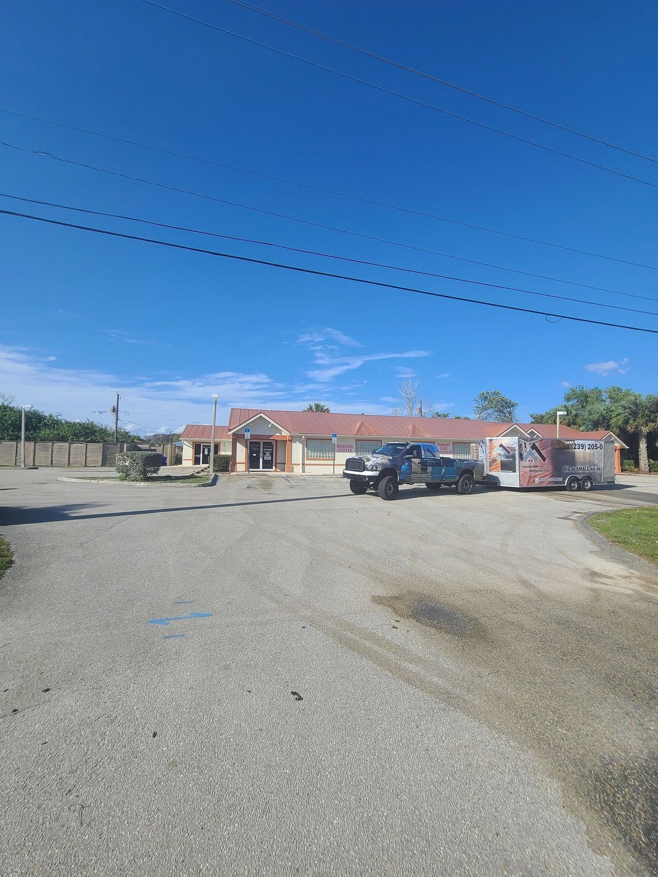 Commercial building with parked truck and trailer