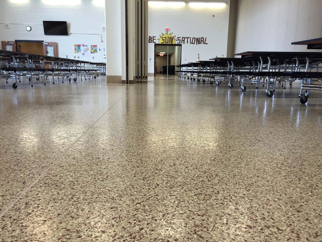 Empty school cafeteria with folding tables