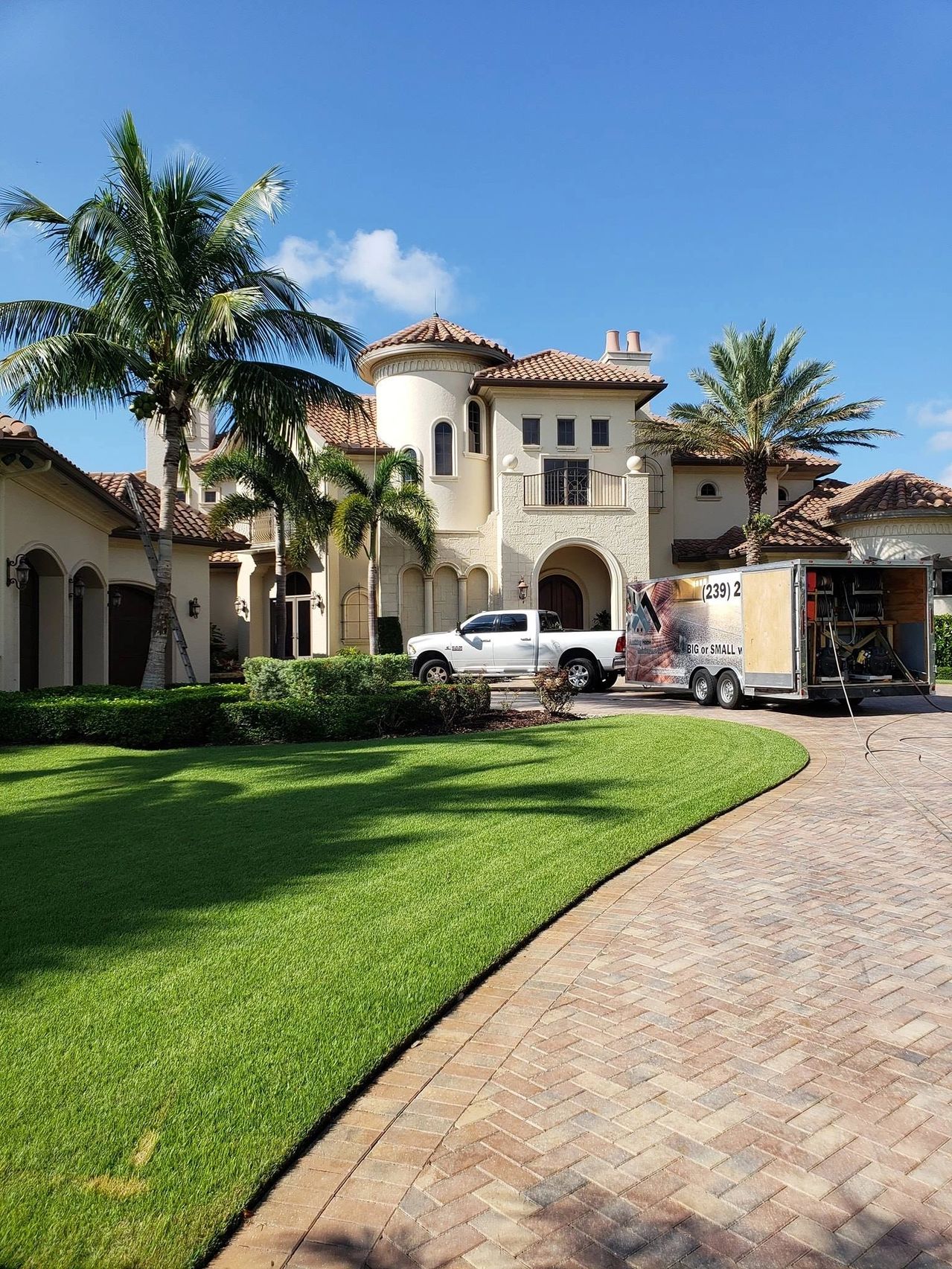 Mediterranean mansion with service truck and trailer
