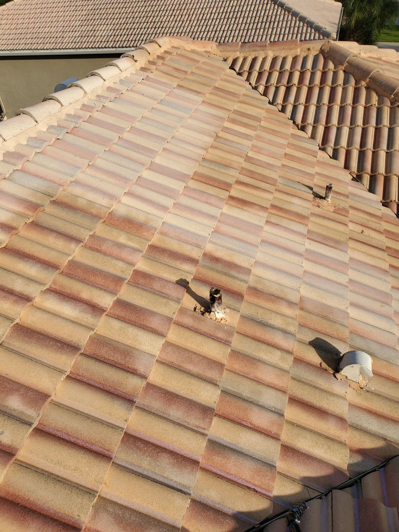 Clay tile roof with vent pipes