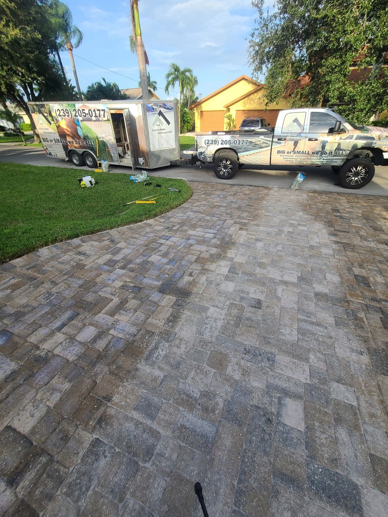 Work truck and trailer on residential driveway