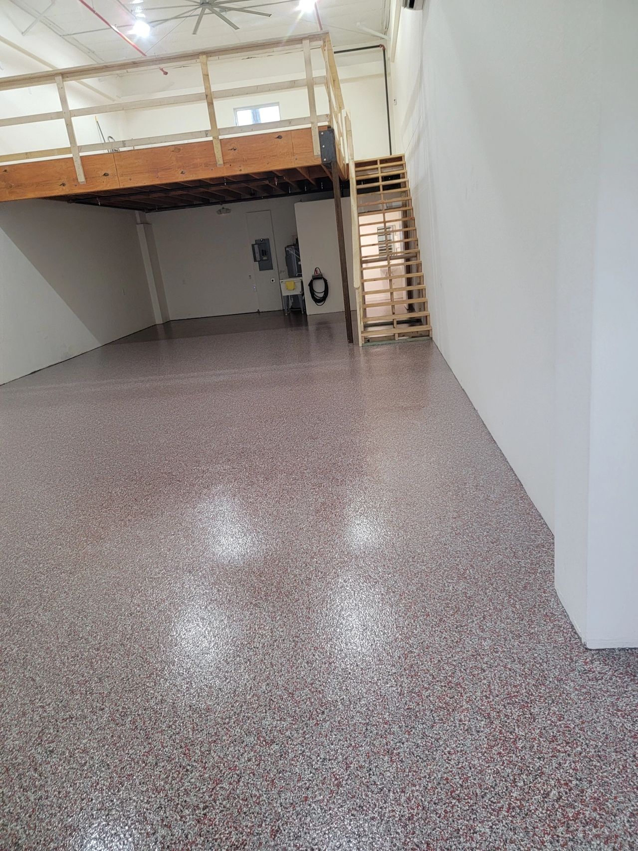 Empty warehouse with speckled epoxy floor