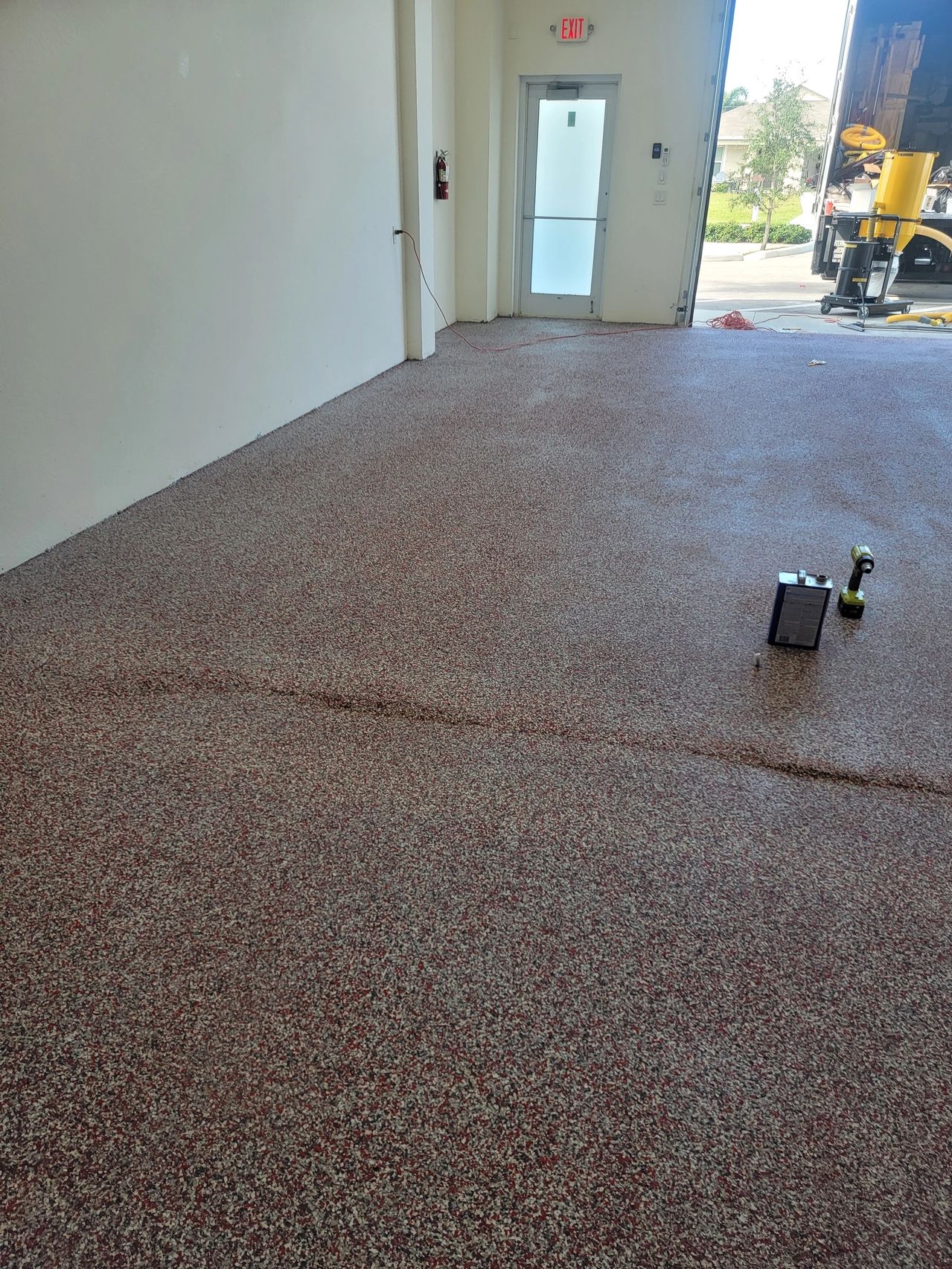 New speckled epoxy floor in empty room