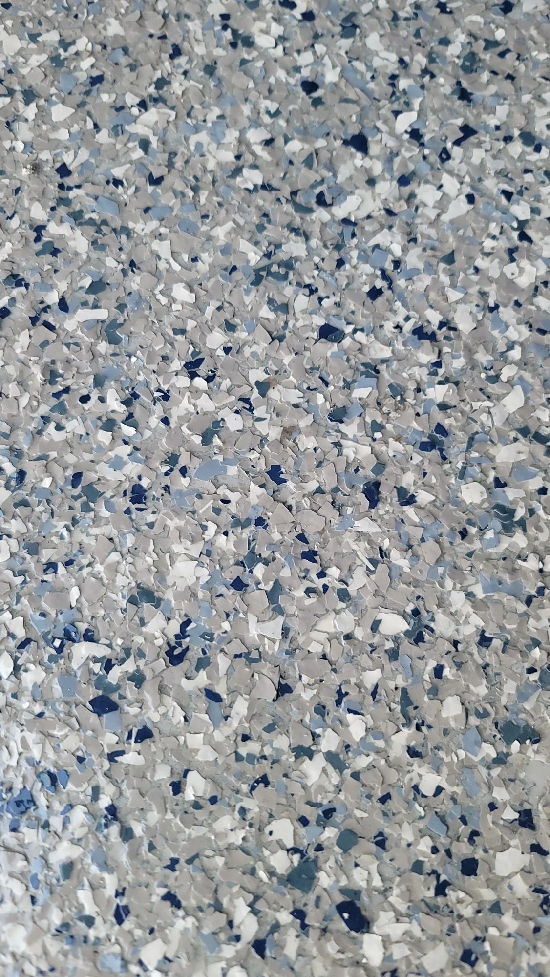 Speckled gray and blue epoxy flooring