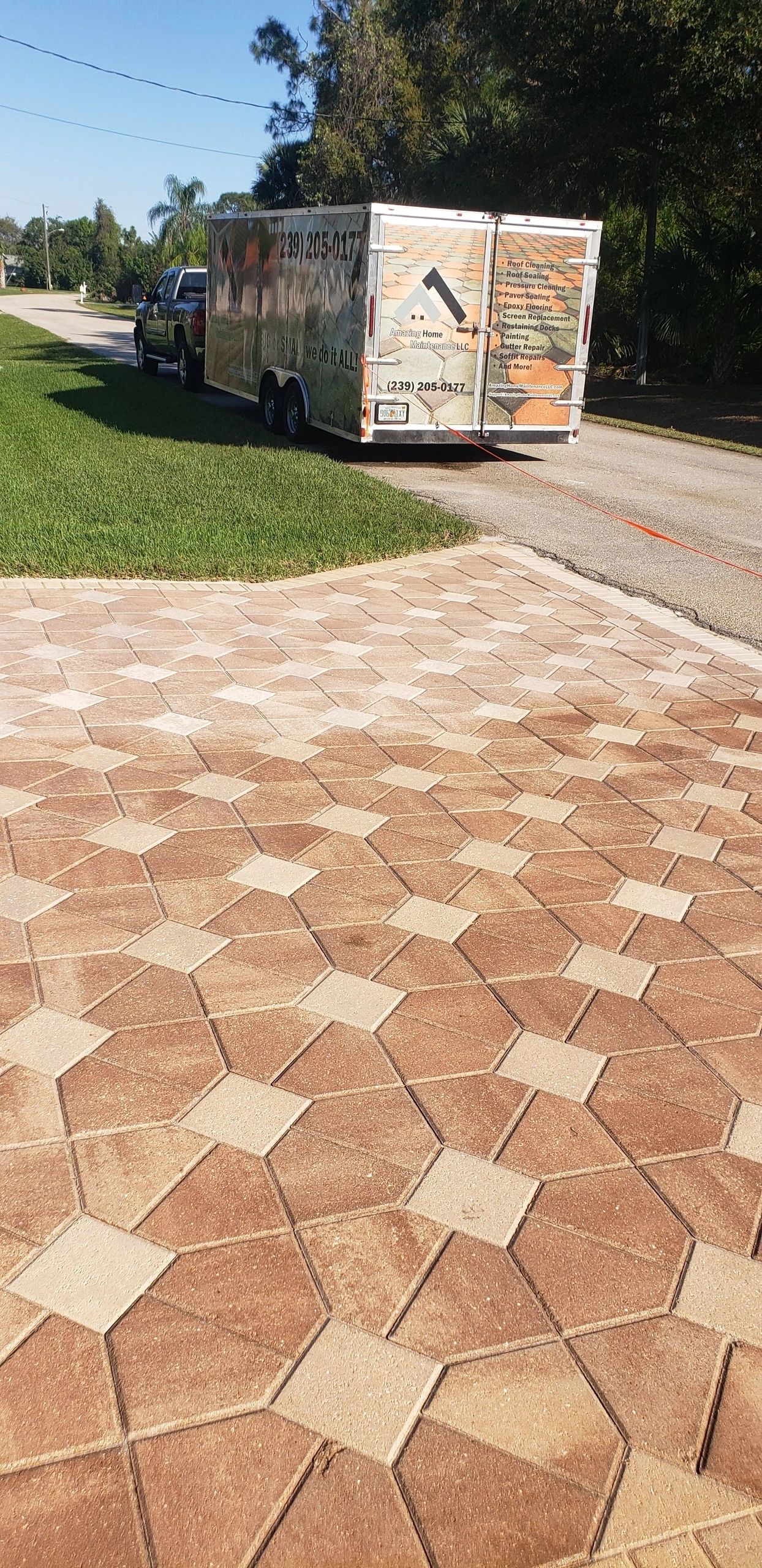 Contractor trailer parked by patterned driveway