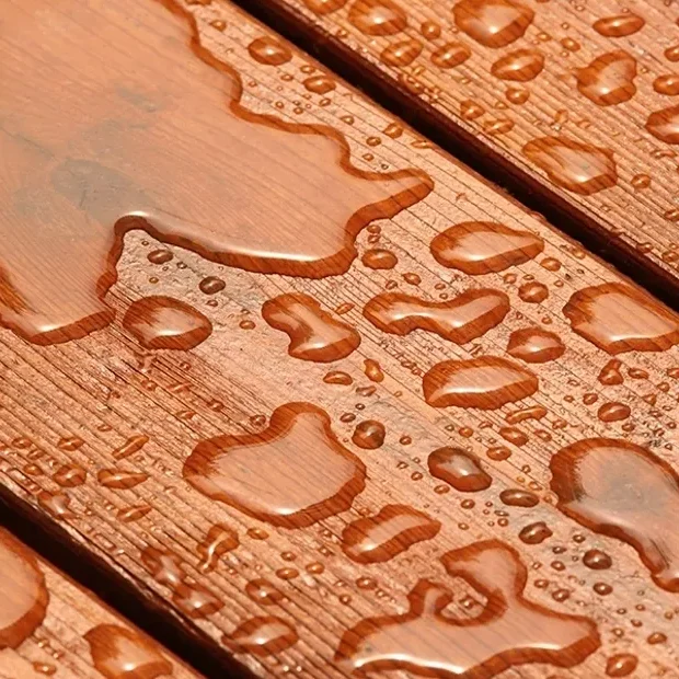 Water droplets on wooden deck planks
