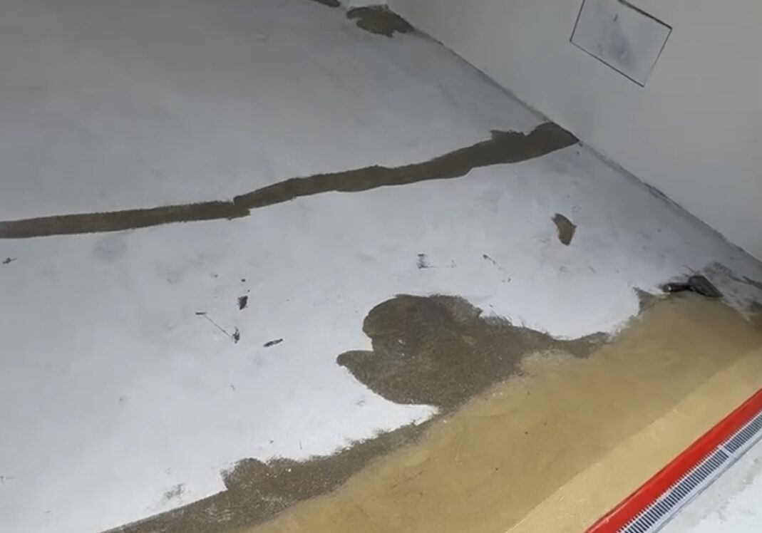 epoxy quick patch on epoxy garage floor, first phase of epoxy garage flake floor coating