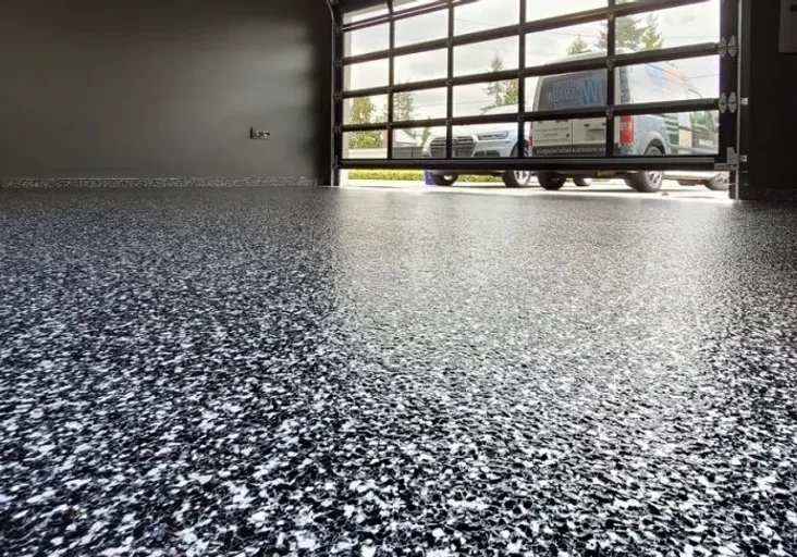 Shiny speckled garage floor with open door