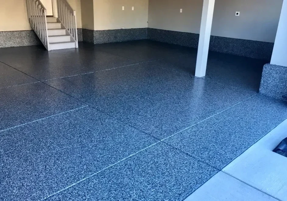 Speckled epoxy garage floor with staircase