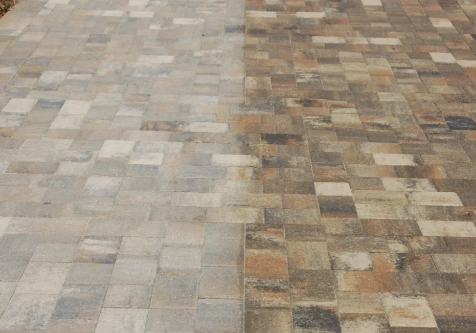 Half-clean, half-dirty paving stone driveway