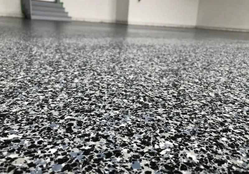 Speckled epoxy garage floor texture close-up