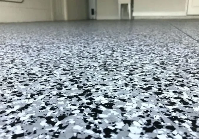 Speckled gray epoxy garage floor close-up