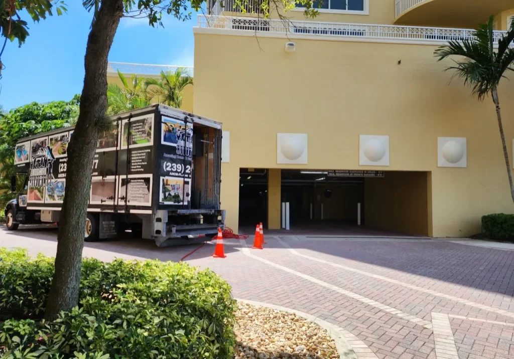 Moving truck at apartment garage entrance