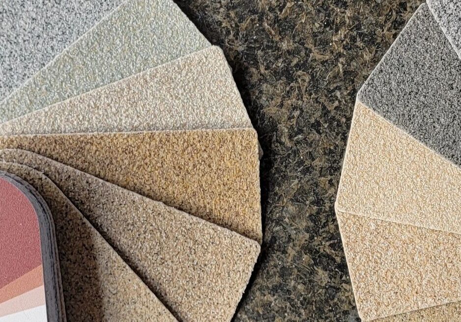 Textured color sample swatches fanned on countertop