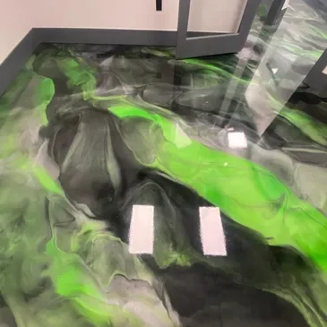 Glossy green and black marbled epoxy floor