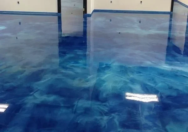 Glossy blue epoxy floor with marbled effect