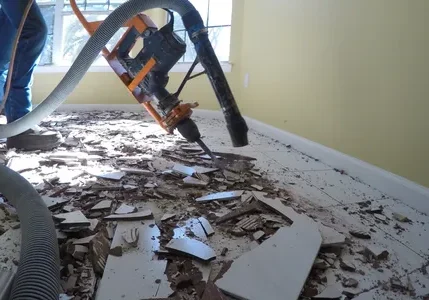 Room floor removal with vacuum and debris