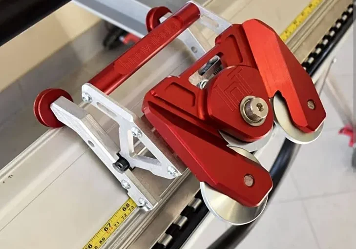Red aluminum sliding carriage on guide rail